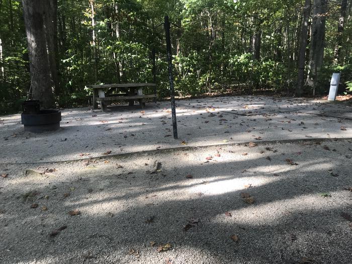 A photo of Site J020 of Loop J at TWIN KNOBS CAMPGROUND with Picnic Table, Electricity Hookup, Fire Pit, Shade, Tent Pad, Lantern Pole