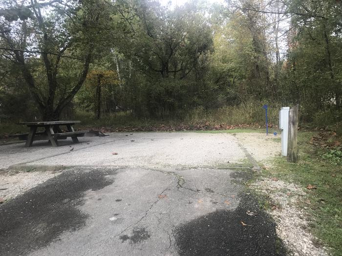 A photo of Site A035 of Loop A at TWIN KNOBS CAMPGROUND with Picnic Table, Electricity Hookup, Fire Pit, Shade, Tent Pad, Lantern Pole, Water Hookup