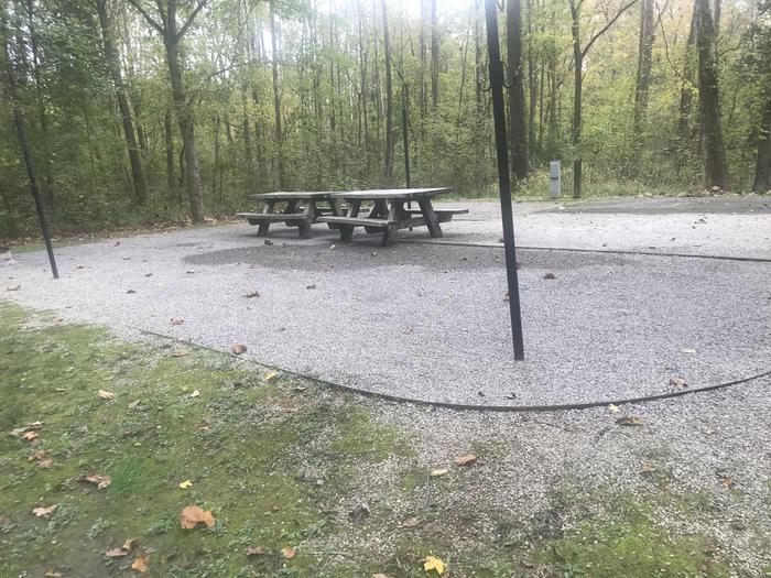 A photo of Site A038 of Loop A at TWIN KNOBS CAMPGROUND with Picnic Table, Electricity Hookup, Fire Pit, Shade, Tent Pad, Lantern Pole