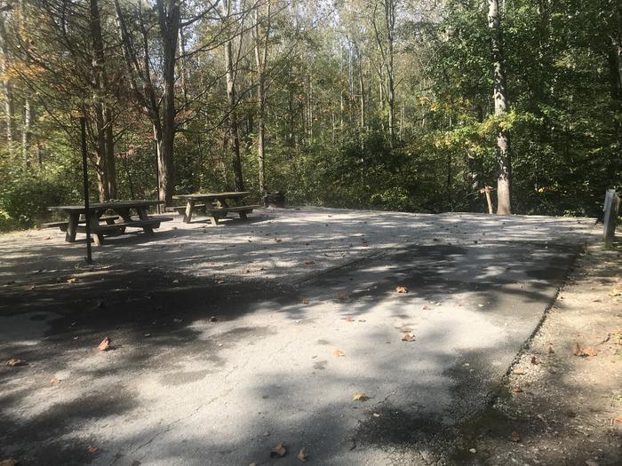 A photo of Site B010 of Loop B at TWIN KNOBS CAMPGROUND with Picnic Table, Electricity Hookup, Fire Pit, Shade, Tent Pad, Lantern Pole