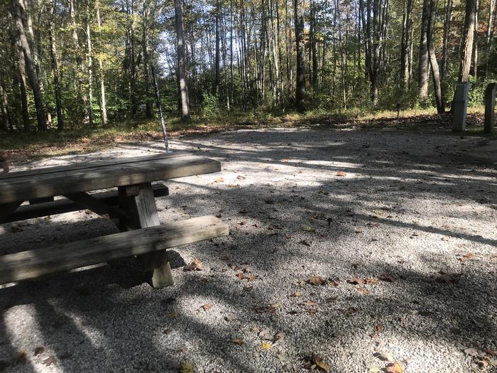 A photo of Site J021 of Loop J at TWIN KNOBS CAMPGROUND with Picnic Table, Electricity Hookup, Fire Pit, Shade, Tent Pad, Lantern Pole, Water Hookup