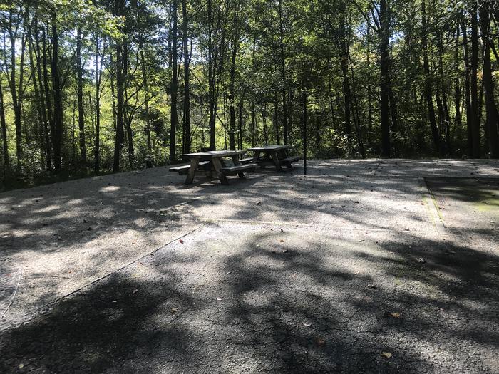 A photo of Site A017 of Loop A at TWIN KNOBS CAMPGROUND with Picnic Table, Electricity Hookup, Fire Pit, Shade, Tent Pad, Lantern Pole
