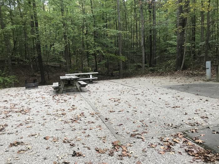 A photo of Site A004 of Loop A at TWIN KNOBS CAMPGROUND with Picnic Table, Electricity Hookup, Fire Pit, Shade, Tent Pad, Lantern Pole