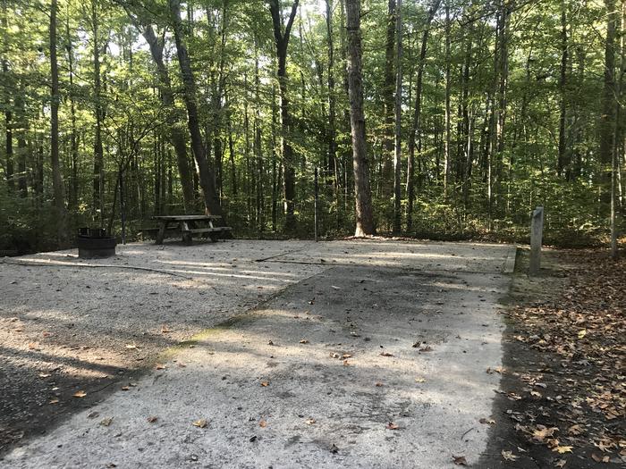 A photo of Site J018 of Loop J at TWIN KNOBS CAMPGROUND with Picnic Table, Electricity Hookup, Fire Pit, Shade, Tent Pad, Lantern Pole