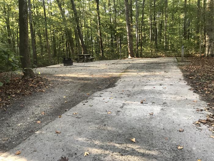 A photo of Site J018 of Loop J at TWIN KNOBS CAMPGROUND with Picnic Table, Electricity Hookup, Fire Pit, Shade, Tent Pad, Lantern Pole