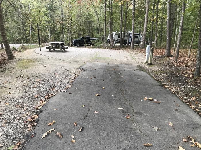 A photo of Site A009 of Loop A at TWIN KNOBS CAMPGROUND with Picnic Table, Electricity Hookup, Fire Pit, Shade, Tent Pad, Lantern Pole