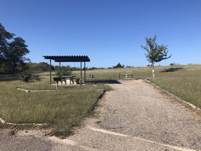 Back in site suitable for medium to small RVs; covered picnic area, fire ring, and grill on site; water and 30amp electric hook ups available Site open April 1st through September 30th