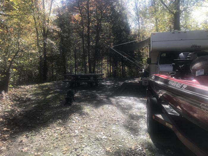 A photo of Site A031 of Loop A at TWIN KNOBS CAMPGROUND with Picnic Table, Electricity Hookup, Fire Pit, Shade, Tent Pad, Lantern Pole