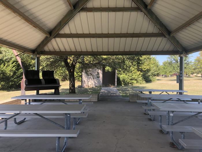 Covered pavilion with picnic tables, outlets, water, and a large smoker grill; on site vault toilet and pathway to the lake front; small volleyball area and netSite is available for day use only from 0600 to 2100 