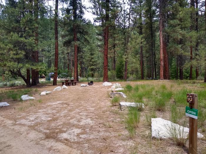 An open campsite near a long driveway.Black Rock Site 10.
