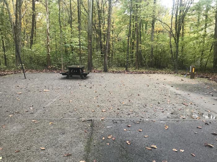 A photo of Site E013 of Loop E at TWIN KNOBS CAMPGROUND with Picnic Table, Electricity Hookup, Fire Pit, Shade, Tent Pad, Lantern Pole, Water Hookup