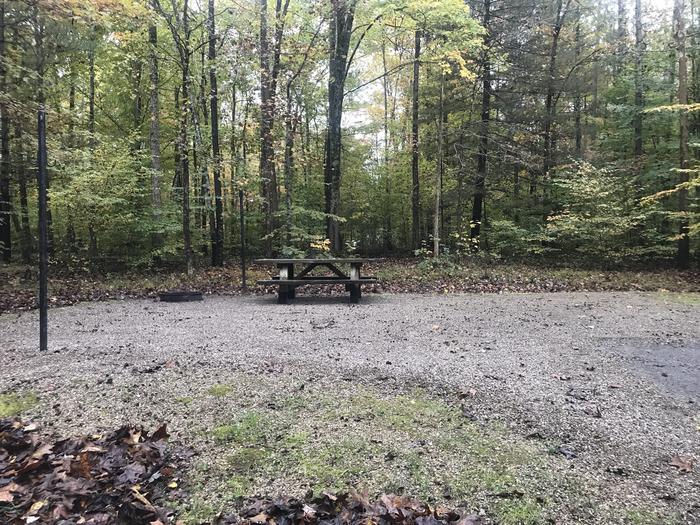 A photo of Site E005 of Loop E at TWIN KNOBS CAMPGROUND with Picnic Table, Fire Pit, Shade, Tent Pad, Lantern Pole
