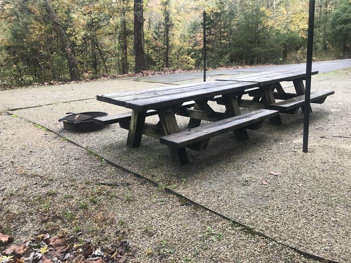 A photo of Site G011 of Loop G at TWIN KNOBS CAMPGROUND with Picnic Table, Fire Pit, Shade, Tent Pad, Lantern Pole