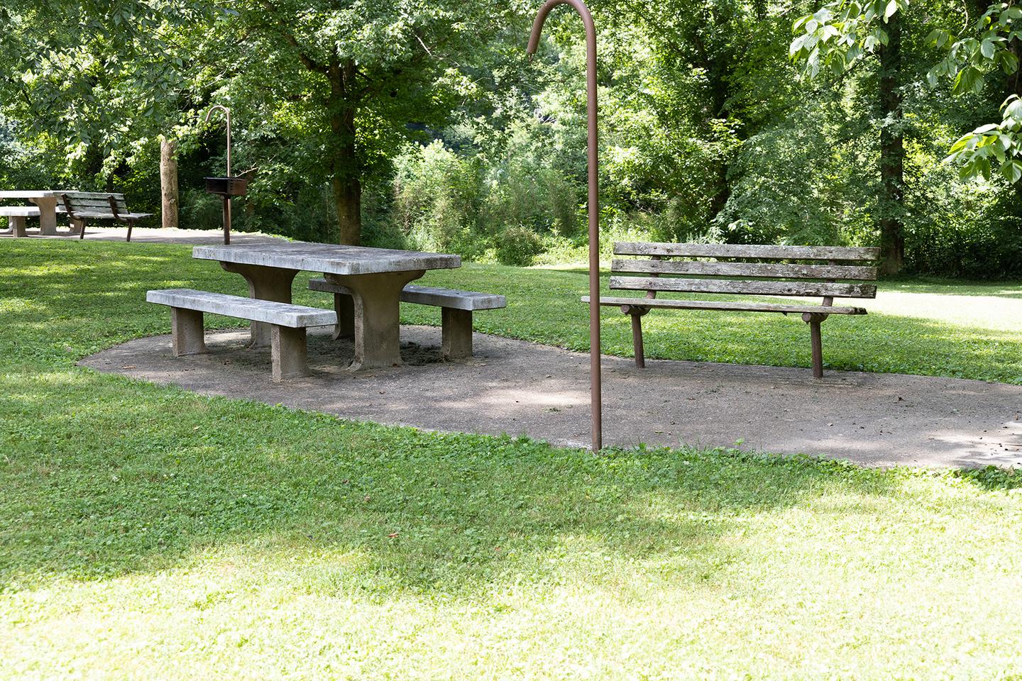 Bench and picnic table Picnic table and bench for visitor enjoyment and view of the river.