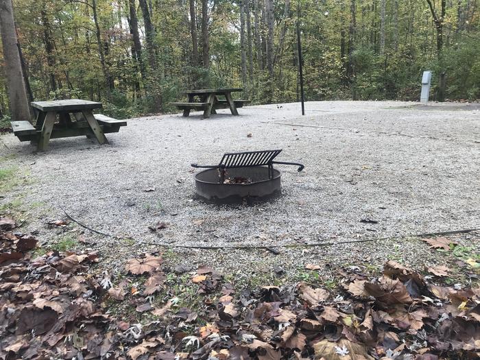 A photo of Site H005 of Loop H at TWIN KNOBS CAMPGROUND with Picnic Table, Electricity Hookup, Fire Pit, Shade, Tent Pad, Lantern Pole