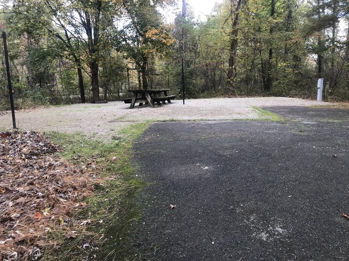A photo of Site H015 of Loop H at TWIN KNOBS CAMPGROUND with Picnic Table, Electricity Hookup, Fire Pit, Shade, Tent Pad, Lantern Pole