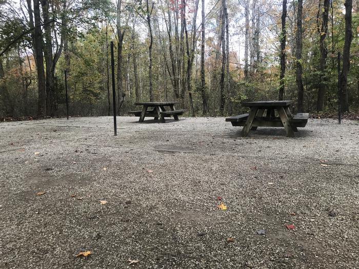 A photo of Site H013 of Loop H at TWIN KNOBS CAMPGROUND with Picnic Table, Electricity Hookup, Fire Pit, Shade, Tent Pad, Lantern Pole