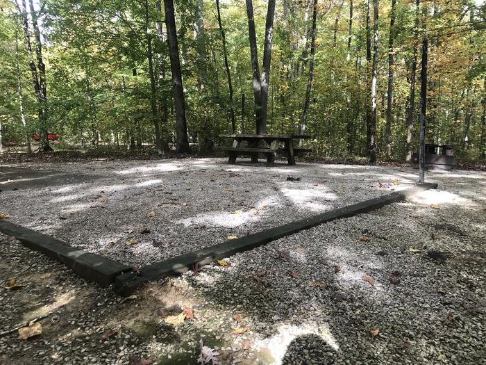 A photo of Site J005 of Loop J at TWIN KNOBS CAMPGROUND with Picnic Table, Electricity Hookup, Fire Pit, Shade, Tent Pad, Lantern Pole