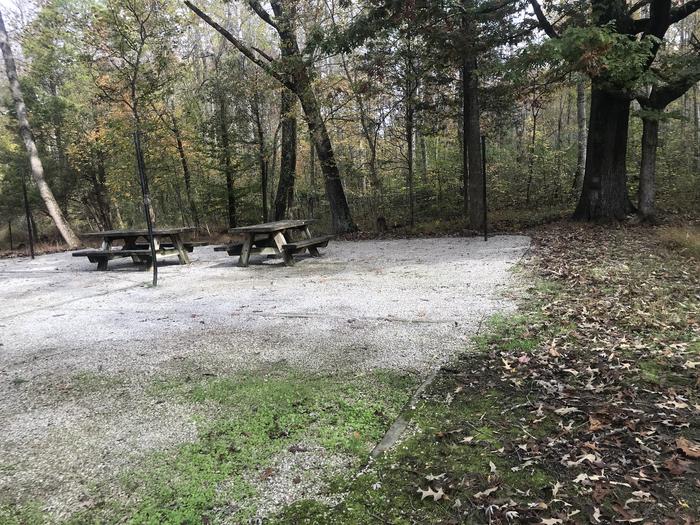 A photo of Site H009 of Loop H at TWIN KNOBS CAMPGROUND with Picnic Table, Electricity Hookup, Fire Pit, Shade, Tent Pad, Lantern Pole