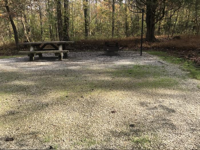 A photo of Site H010 of Loop H at TWIN KNOBS CAMPGROUND with Picnic Table, Electricity Hookup, Fire Pit, Shade, Tent Pad, Lantern Pole