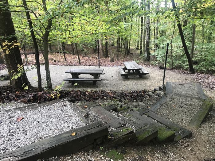 A photo of Site H004 of Loop H at TWIN KNOBS CAMPGROUND with Picnic Table, Electricity Hookup, Fire Pit, Shade, Tent Pad, Lantern Pole