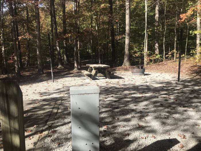 A photo of Site A001 of Loop A at TWIN KNOBS CAMPGROUND with Picnic Table, Electricity Hookup, Fire Pit, Shade, Tent Pad, Lantern Pole