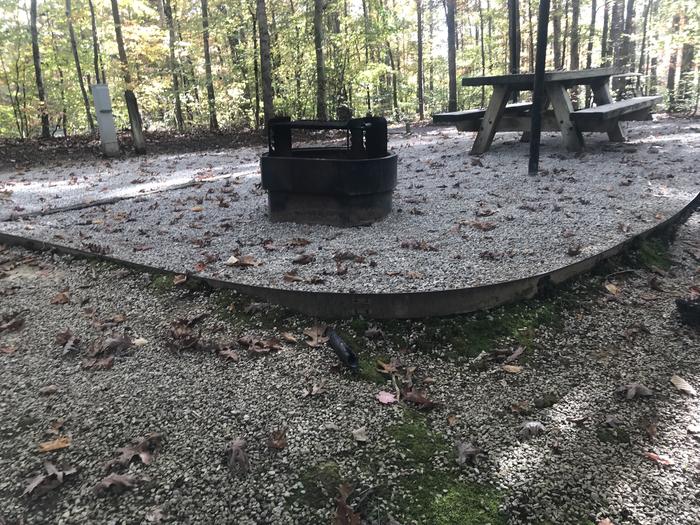 A photo of Site A002 of Loop A at TWIN KNOBS CAMPGROUND with Picnic Table, Electricity Hookup, Fire Pit, Shade, Tent Pad, Lantern Pole