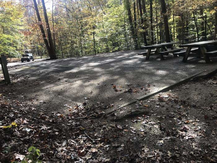 A photo of Site A004 of Loop A at TWIN KNOBS CAMPGROUND with Picnic Table, Electricity Hookup, Fire Pit, Shade, Tent Pad, Lantern Pole