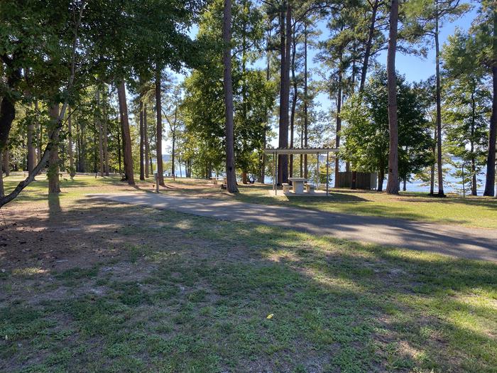 A photo of Site 57 of Loop LOOD at SAN AUGUSTINE with Picnic Table, Electricity Hookup, Fire Pit, Shade, Lantern Pole, Water Hookup, Lean To / Shelter