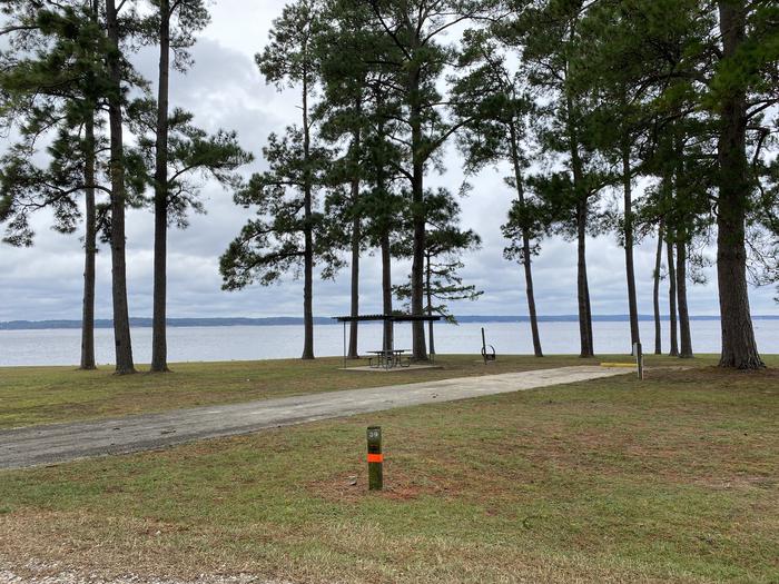 A photo of Site 39 of Loop LOOB at RAYBURN with Picnic Table, Electricity Hookup, Fire Pit, Shade, Waterfront, Lantern Pole, Water Hookup, Lean To / Shelter