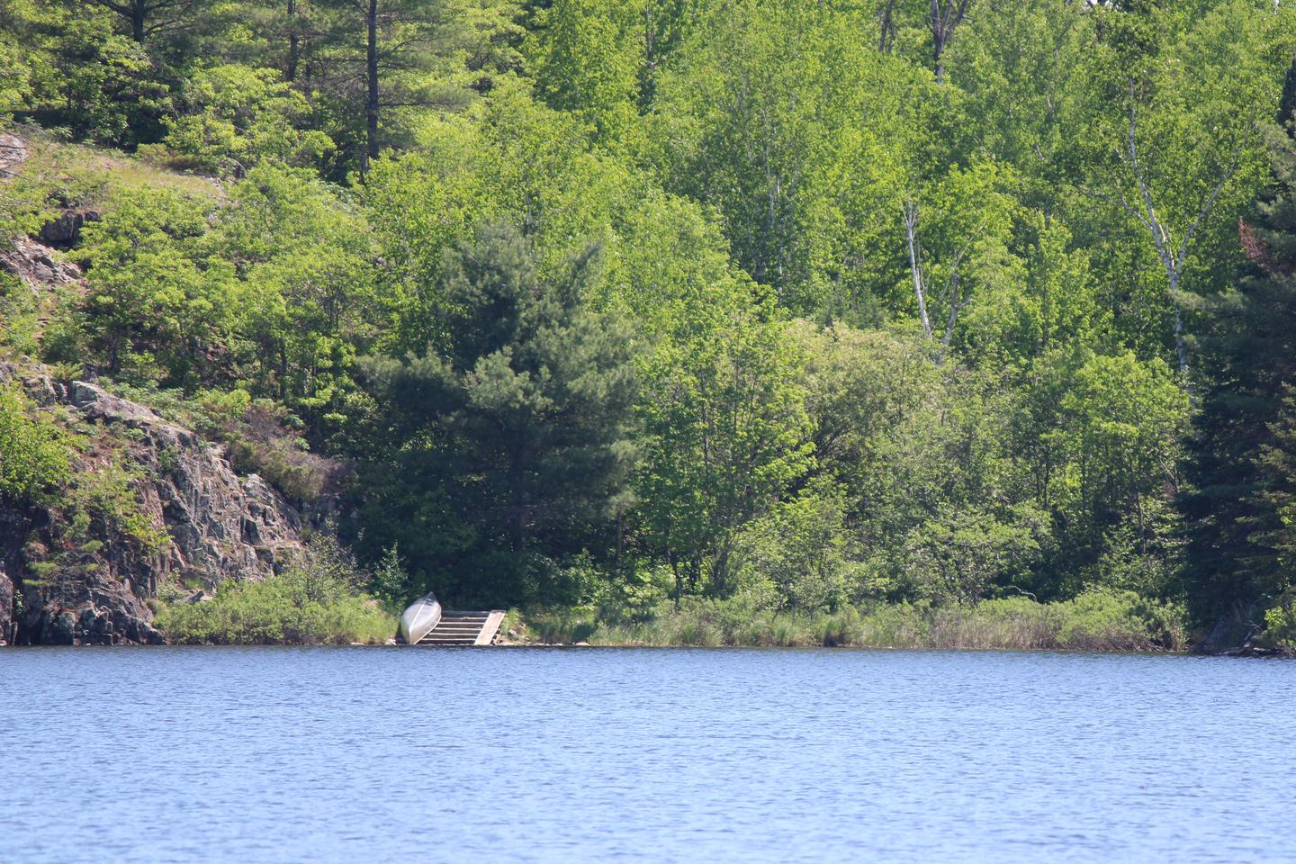 View of Ek Lake canoe rack from the water