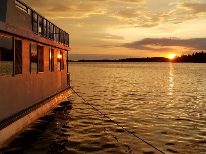 Houseboat moored at sunset