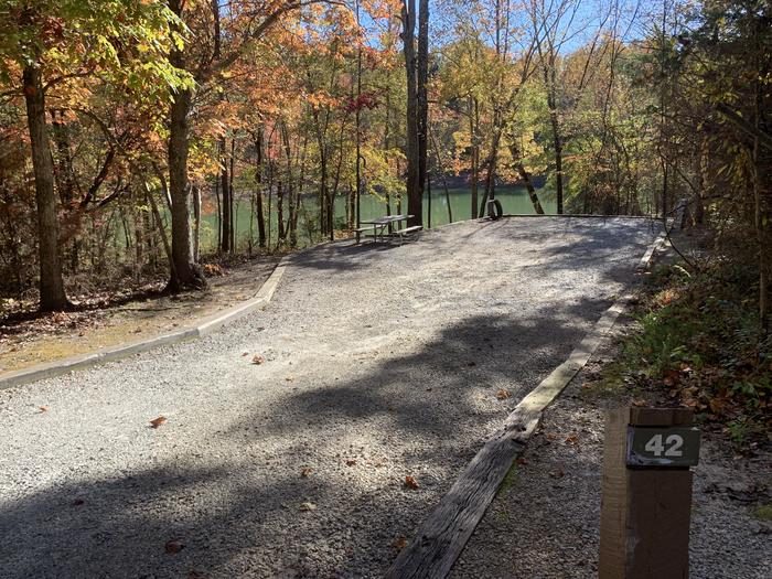 A photo of Site 042 of Loop C38 at RUDDS CREEK REC. AR. with Picnic Table, Electricity Hookup, Fire Pit, Lantern Pole, Water Hookup