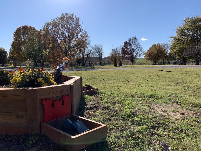 Handmade custom garden beds filled with seasonal decoration and flowers located all throughout Brush Creek campground.A photo of facility Brush Creek Public Use Area
