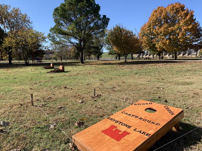Handmade custom corn hole games provided to guests located near the playground in Brush Creek campground.A photo of facility Brush Creek Public Use Area with cornhole boards. 