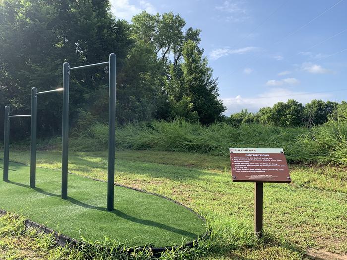 Unique to Keystone Lake, a mile long fitness trail located in Brush Creek offers obstacles. Featured is the pull up station which is located at one of four stations on the trail.A photo of fitness trail facility Brush Creek Public Use Area
