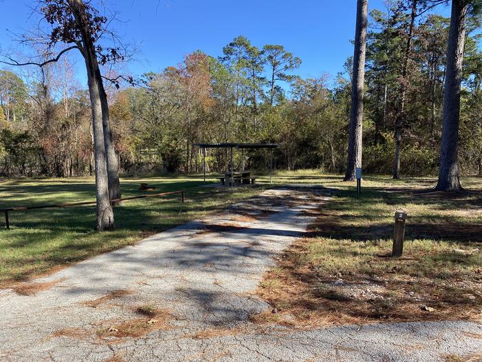 A photo of Site 02 of Loop LOOA at SAN AUGUSTINE with Picnic Table, Electricity Hookup, Fire Pit, Shade, Waterfront, Lantern Pole, Water Hookup, Lean To / Shelter