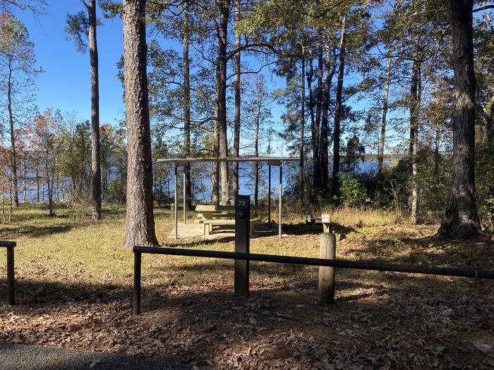 A photo of Site 72 of Loop LOOE at SAN AUGUSTINE with Picnic Table, Electricity Hookup, Fire Pit, Shade, Waterfront, Water Hookup, Lean To / Shelter