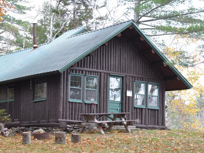 Haskell Hut located in Katahdin Woods and Waters National Monument.Situated along the East Branch Penobscot River, Haskell Hut offers overnight accommodations for groups up to eight people.