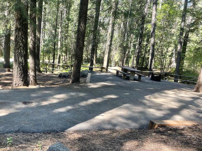 Accessible site with paved parking and picnic table and fire ring.Spring Creek Campground Site 13 - fully accessible.