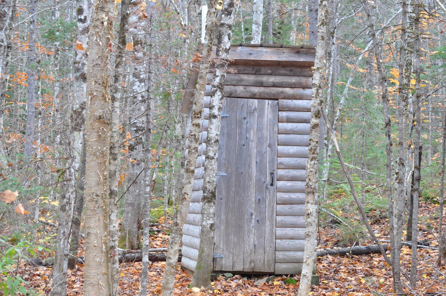 Wooden pit toilet structure at Grand Pitch Lean-to.A pit toilet is located near Grand Pitch Lean-to.