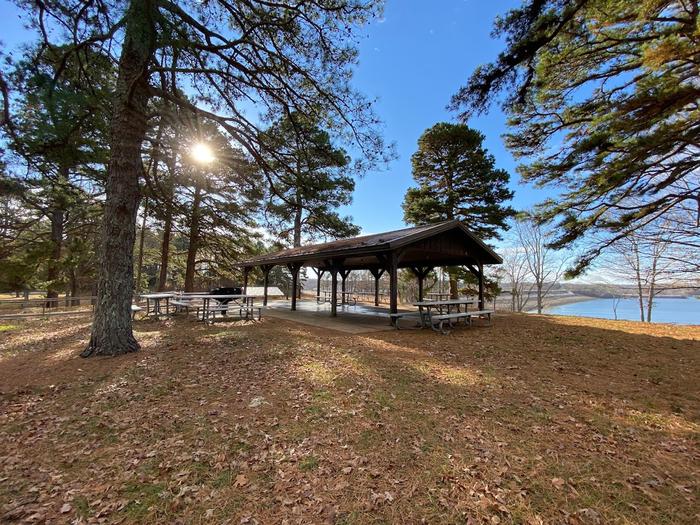 Shelter at Eagle Point Recreation Shelter 5 at Eagle Point. This shelter is handicapped accessible and sits atop a hill with views of the lake. It's in a spacious area, has 8 picnic tables, and is near restroom facilities and playground areas.