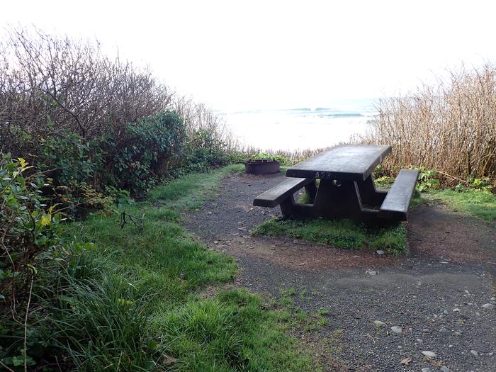 concrete picnic table and fire pit on a bluff overlooking oceanA23- table and fire ring