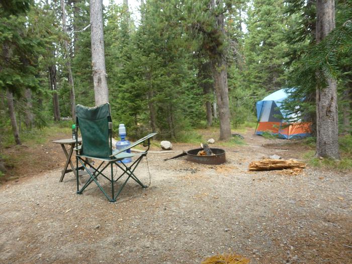 Lewis Lake site 7 with camp chair, fire ring, and tent.Lewis Lake site 7