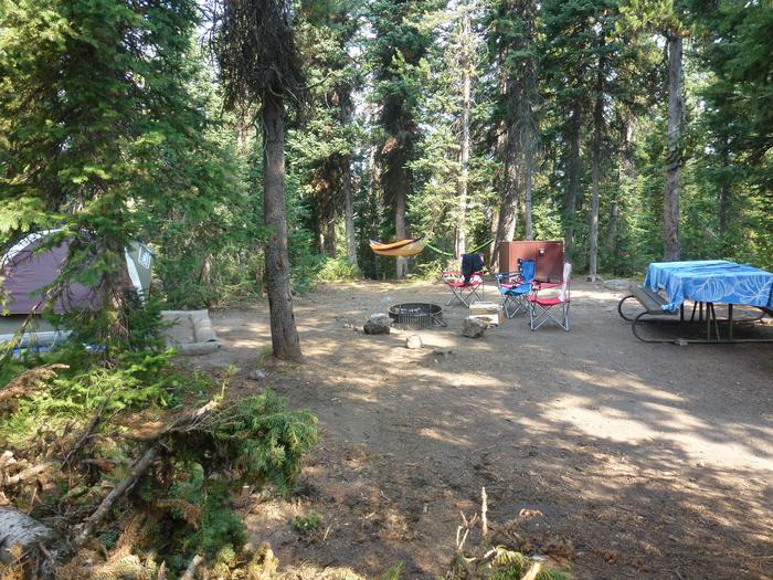 Lewis Lake site 13 with tent and camp chairs. Lewis Lake site 13