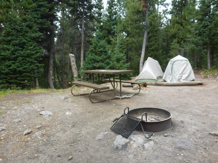 Lewis Lake site 9 with fire ring, picnic table, and two tents.Lewis Lake site 9