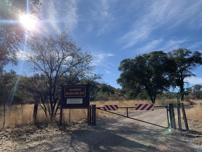 A locked entry gate to the campground with a sign that says "Calabasas Recreation Site"iteThis is what the entry gate to the campground looks like from the road. You will receive a lock code to enter when you reserve the site!