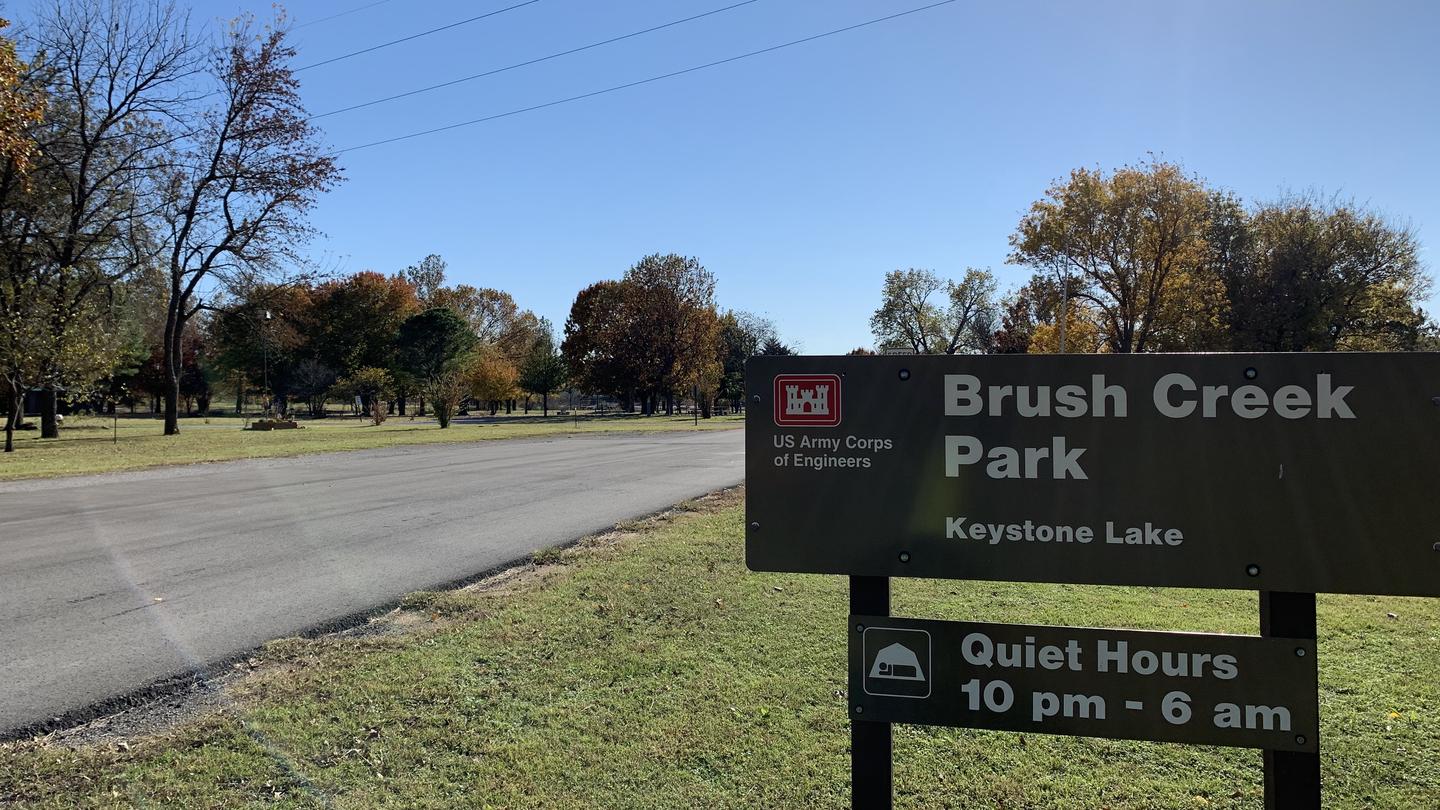 Brush Creek park sign and entrance road to campground at Keystone Lake.A photo of facility Brush Creek Public Use Area