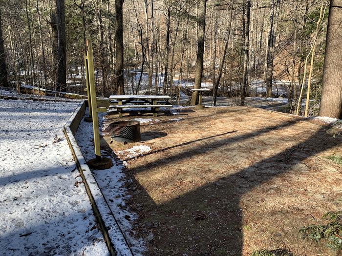 A photo of Site 033 of Loop B at CAVE MOUNTAIN LAKE FAMILY CAMP with Picnic Table, Fire Pit, Lantern Pole