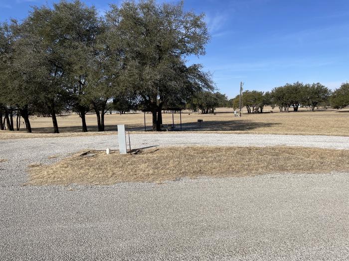 A photo of Site T068 of Loop L2 at LAKESIDE (TX) with Picnic Table, Fire Pit, Shade, Full Hookup